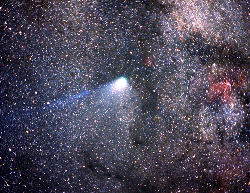 Halley’s Comet streaking across the night sky with a glowing tail