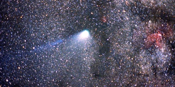 Halley’s Comet streaking across the night sky with a glowing tail